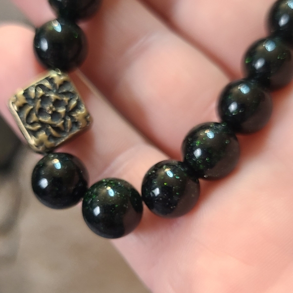 10mm green Goldstone bracelet with Tibetan style charms. - Picture 2 of 5